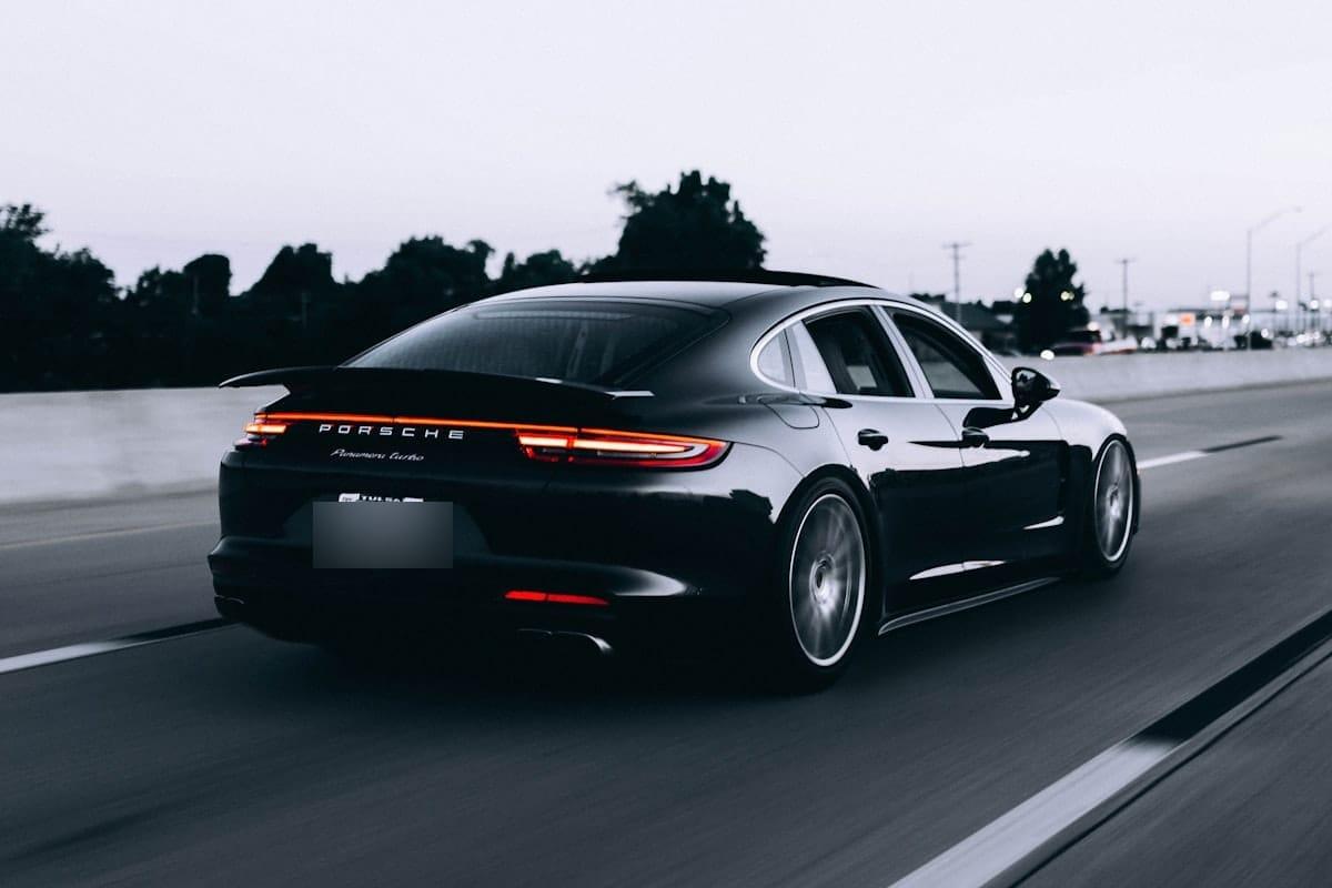 Car photo where only the license-plate region is blurred and the rest stays sharp — Blurify result